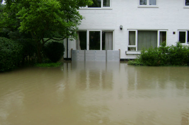 Property with flood barriers keeping floodwater out.