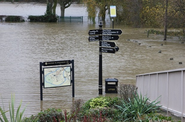 Floodwater covering a park.